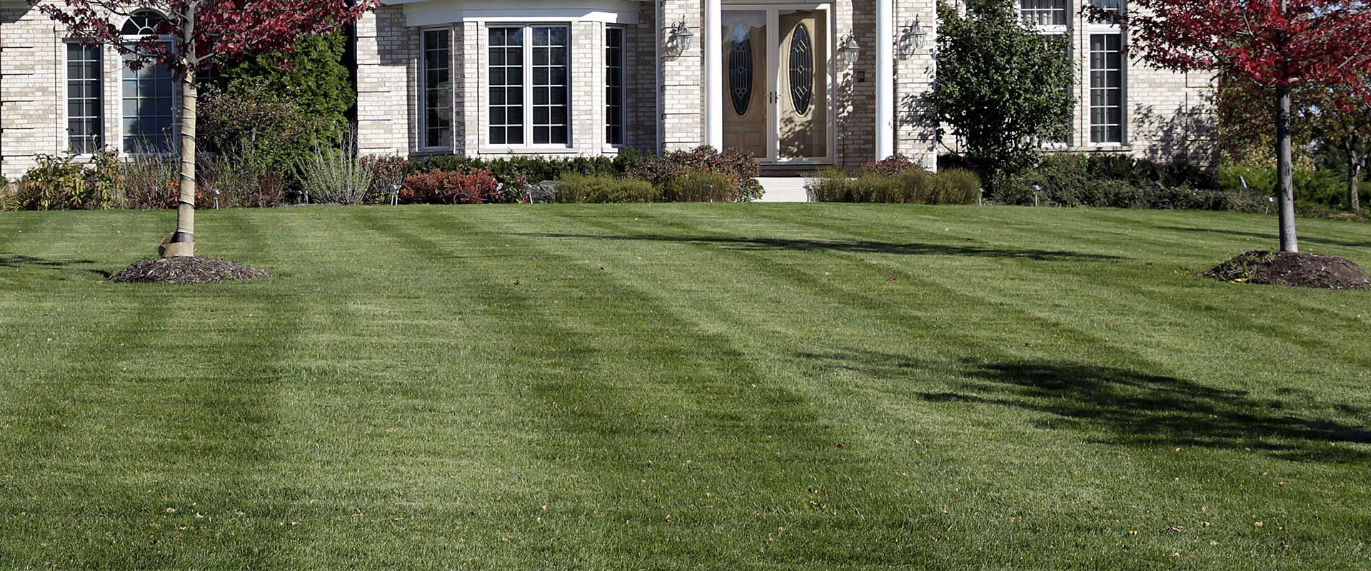 Lawn striping done by our mowing team in front of a home in Rhinebeck.